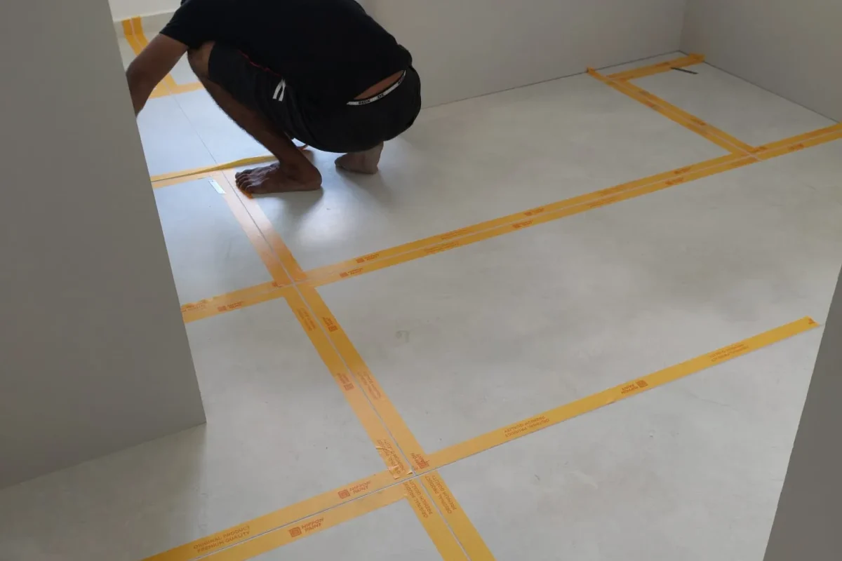 Professional epoxy floor installation on a prepared concrete surface